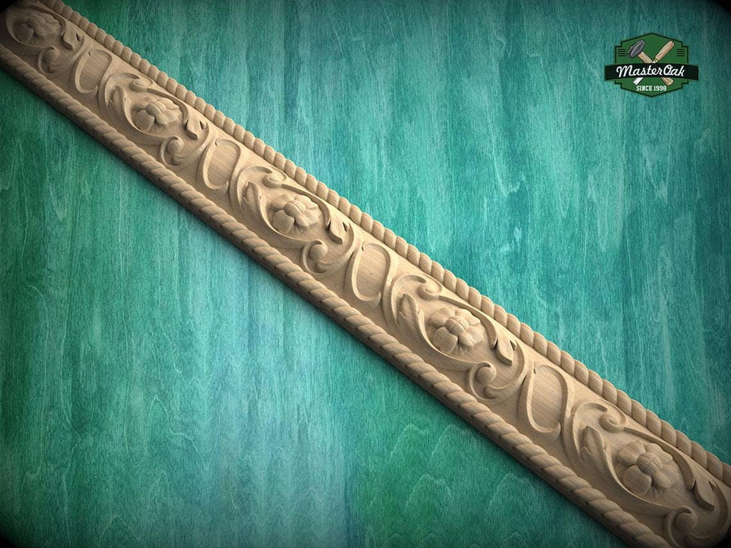 a decorative wooden border with intricate floral designs, set against a green textured background.