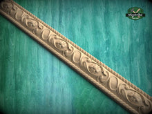 Load image into Gallery viewer, a decorative wooden border with intricate floral designs, set against a green textured background.
