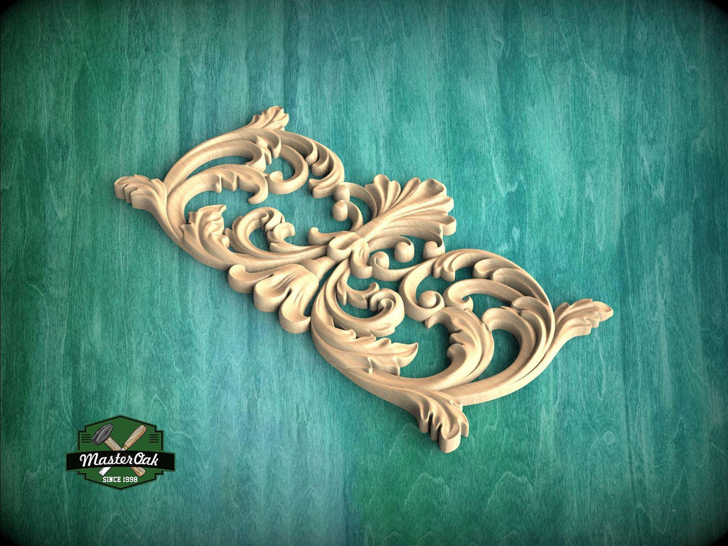 A decorative wooden carving with intricate scrollwork is displayed against a green background.