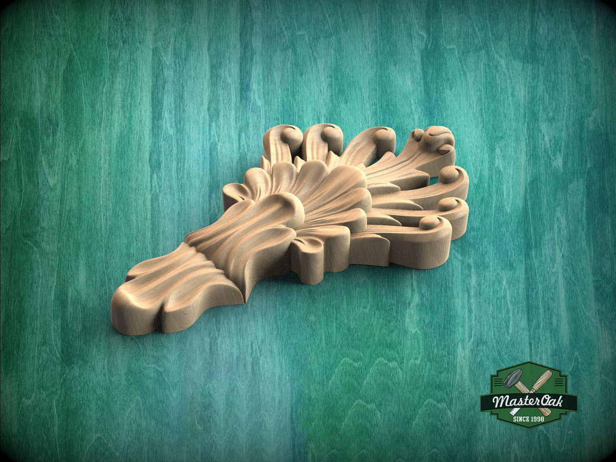 A wooden carving of a stylized flower or leaf design is displayed against a green background.