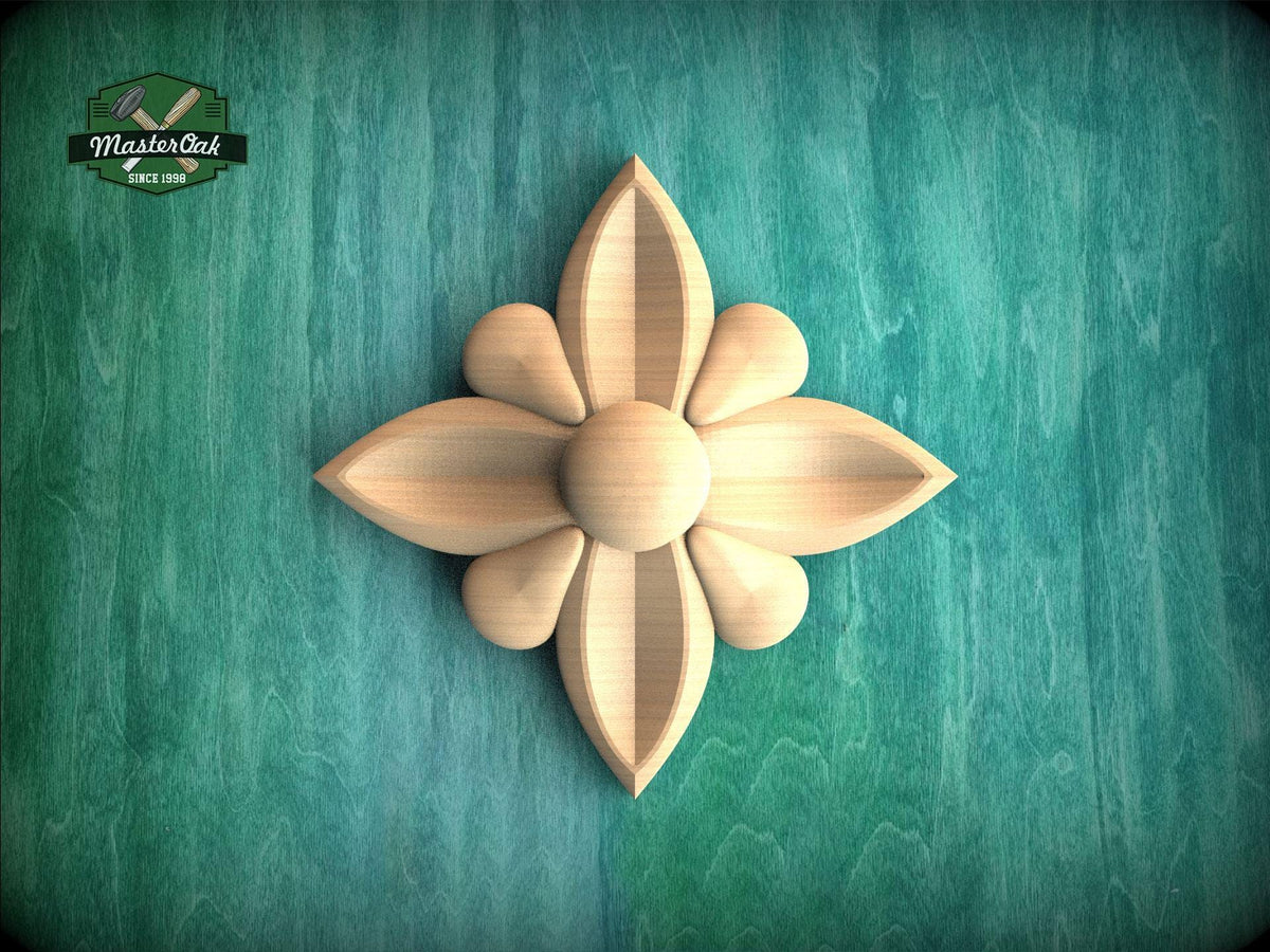 A wooden flower-shaped carving is displayed against a green background.