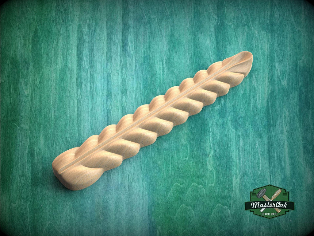 A wooden braided object is shown against a green background.
