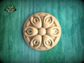 Spiral Flower Rosette – Carved Wooden Ornament with Flowing Petals Description: