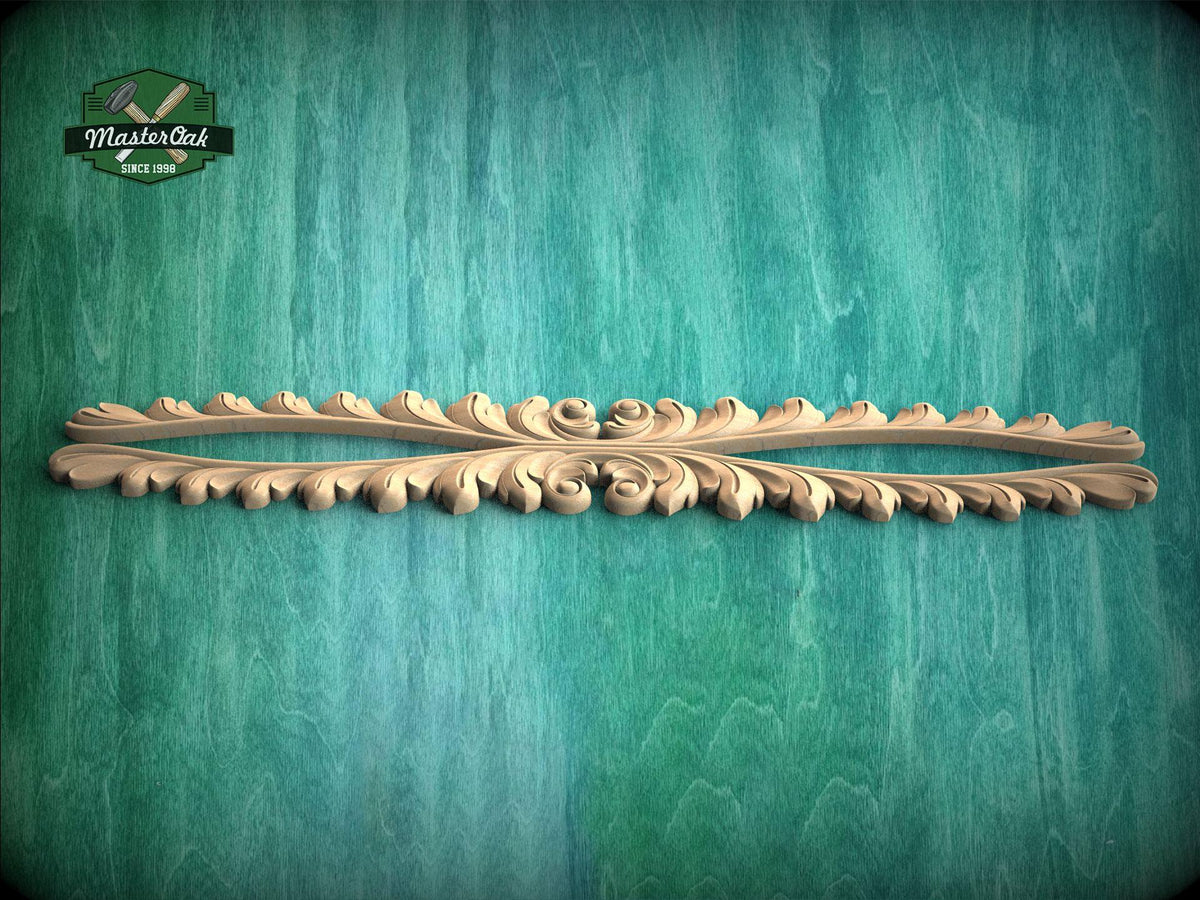 A decorative wooden carving with an intricate floral design is displayed against a textured green background.