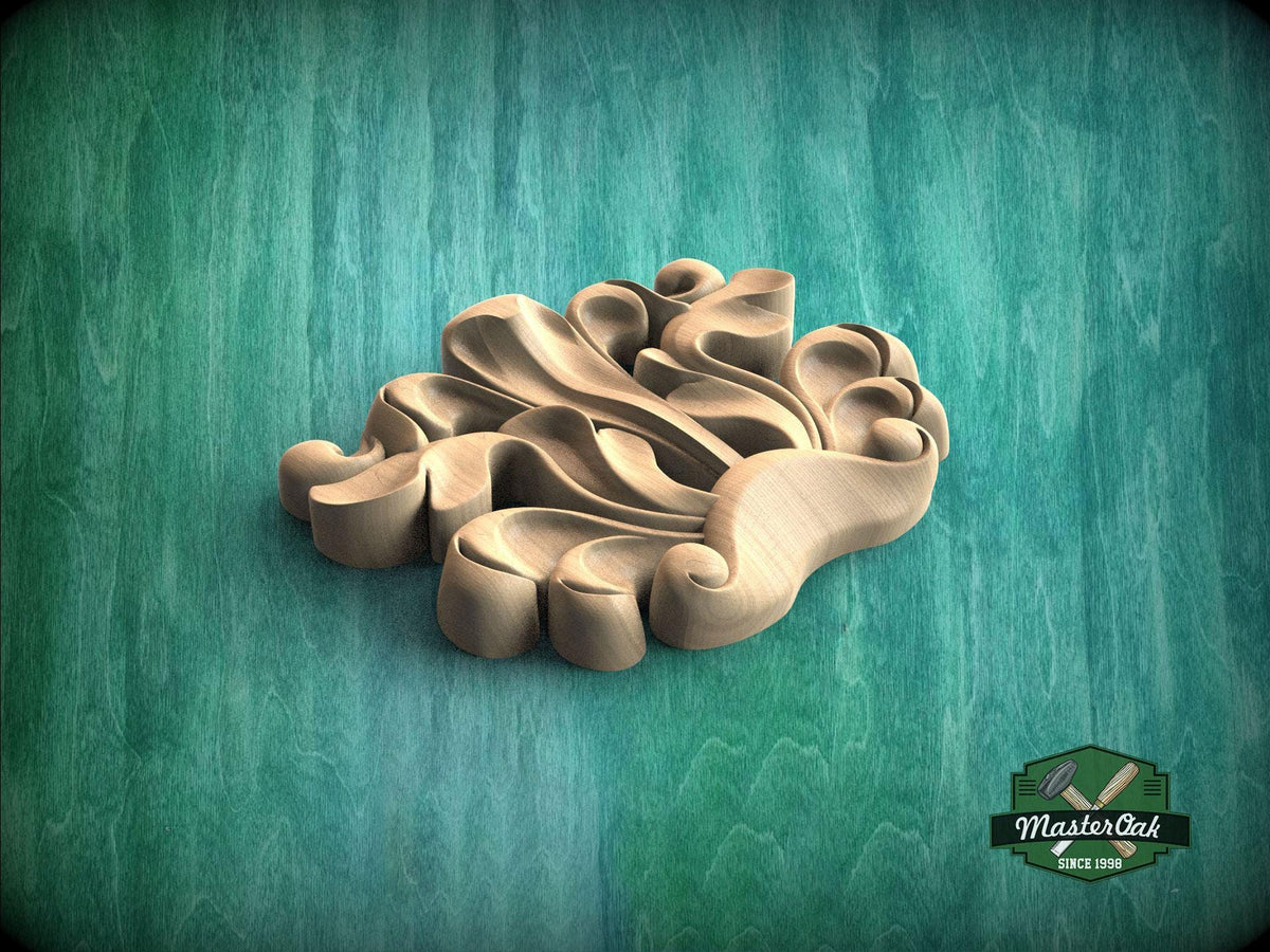 A wooden carving of a stylized leaf or flower design is displayed against a green background.