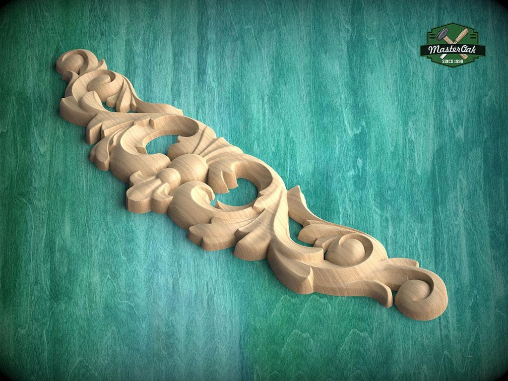 A decorative wooden carving with intricate floral and scrollwork designs is displayed against a green background.