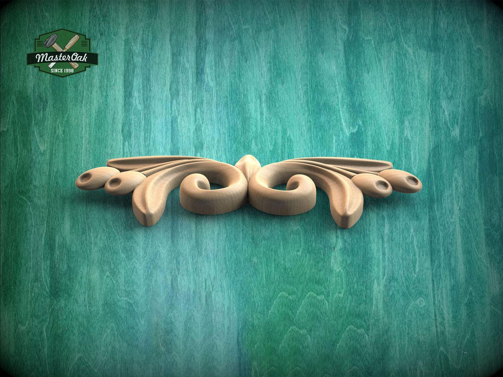 A decorative wooden carving with a floral design is displayed against a textured green background.