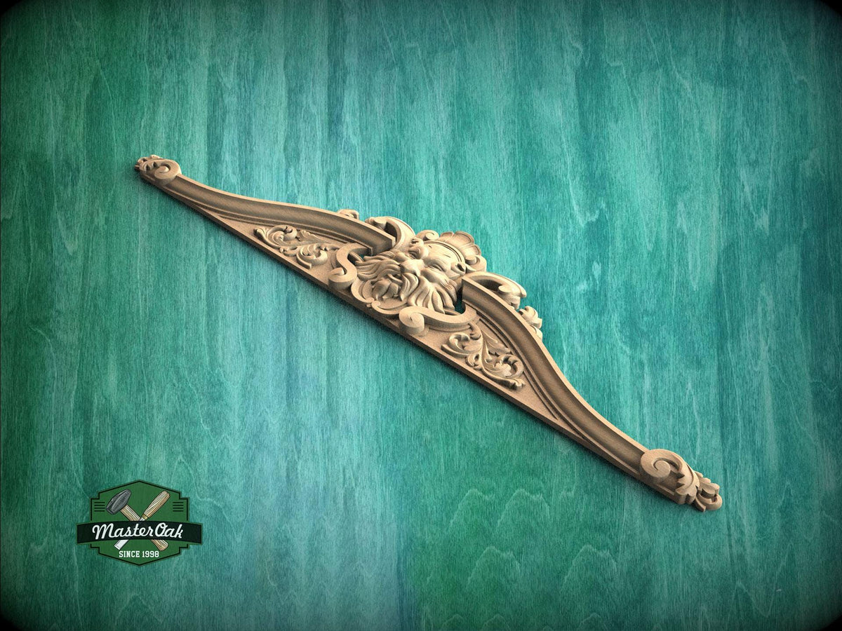 A decorative wooden carving or mold is displayed against a green textured background.