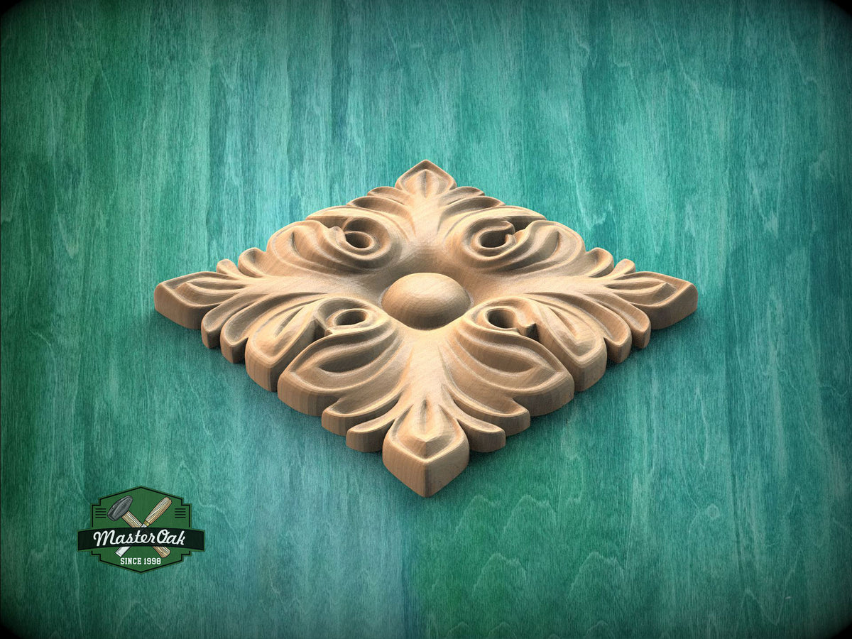 A decorative wooden panel with an intricate floral design, set against a green wooden background.