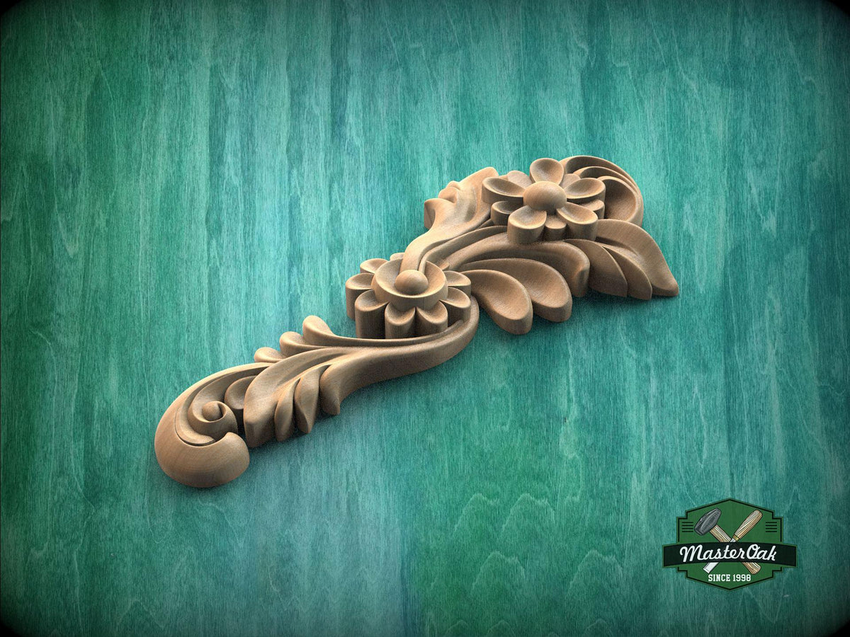 A wooden carving of a flower-like design is displayed against a green background.