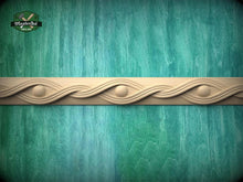 Load image into Gallery viewer, a decorative border made of wood, with a wavy pattern and circular elements, set against a green textured background.

