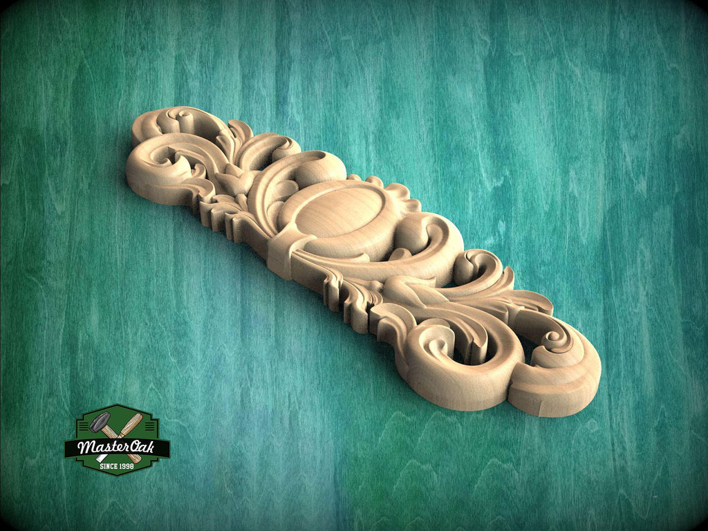 a wooden carved object on a green surface