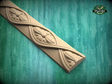 Load image into Gallery viewer, A decorative wooden panel with intricate floral designs is displayed against a green background.
