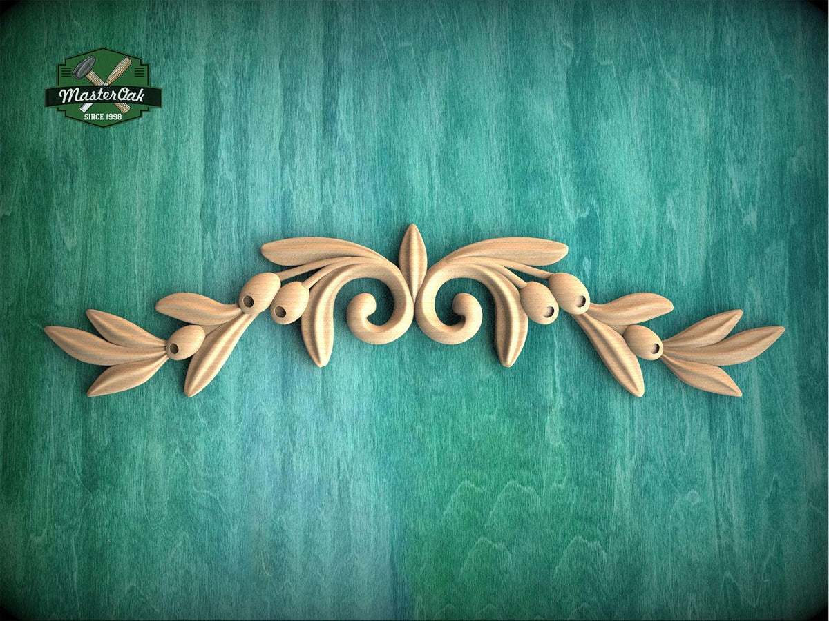 a wooden carving of leaves on a green background