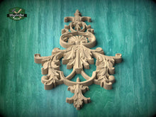 Load image into Gallery viewer, a beautifully carved wooden piece with intricate designs, set against a green background.
