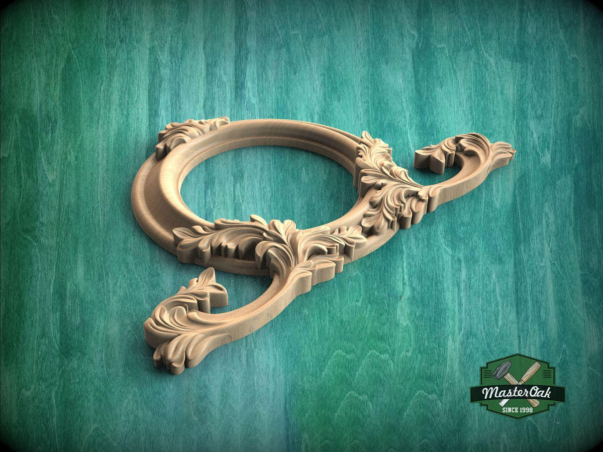 A wooden ornate frame with intricate carvings is displayed against a green background.
