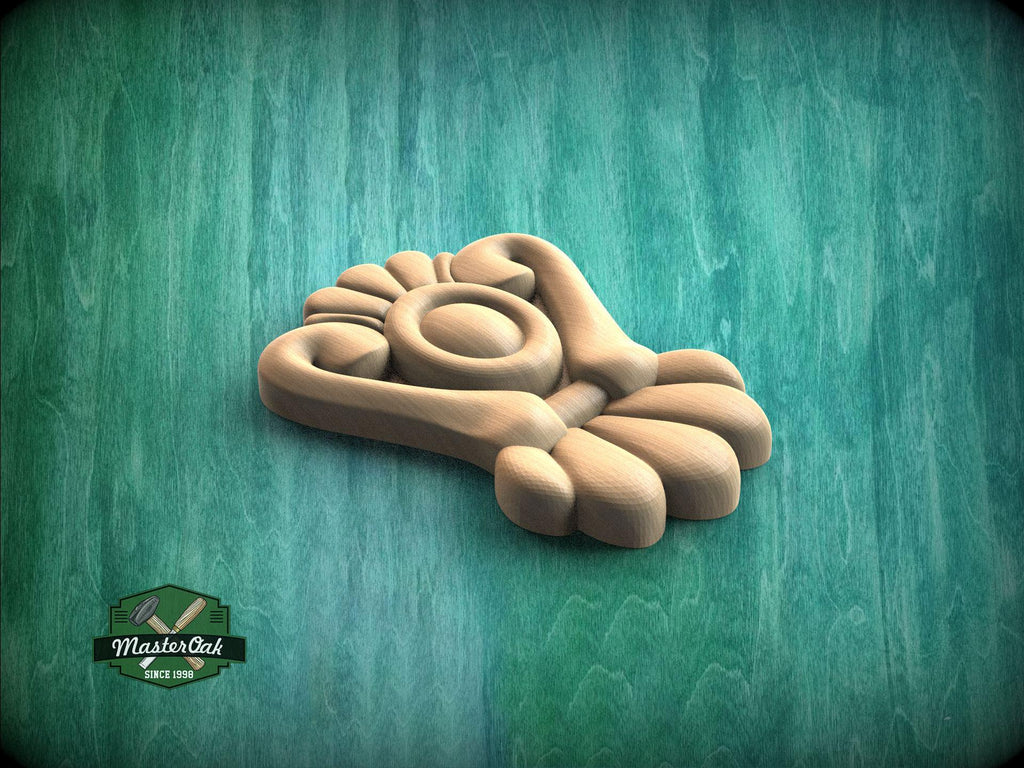 A wooden carving of a stylized bird or bird-like figure is displayed against a green background.