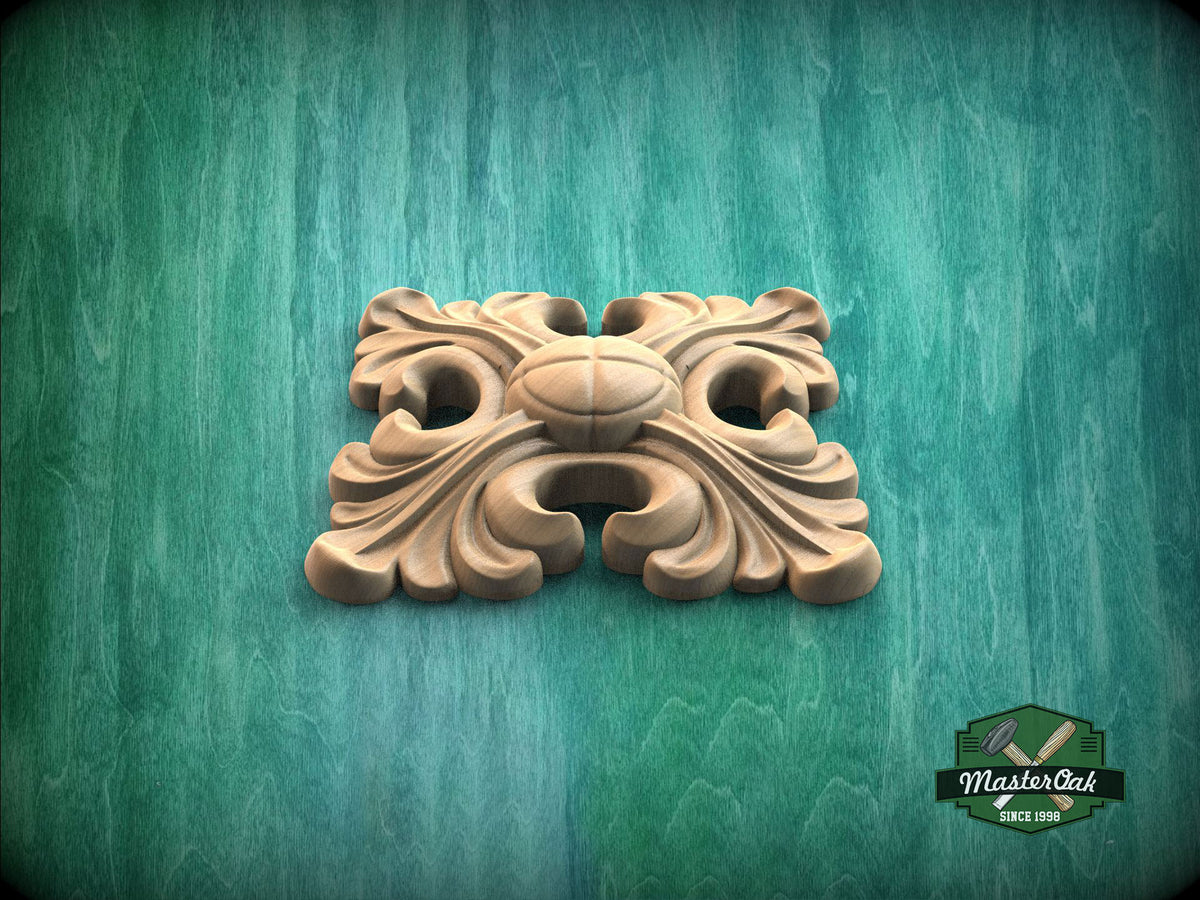A wooden ornamental piece with a floral design is displayed against a green background.