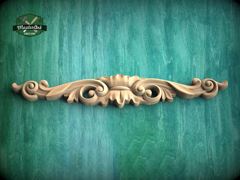 a wood carving on a green wall
