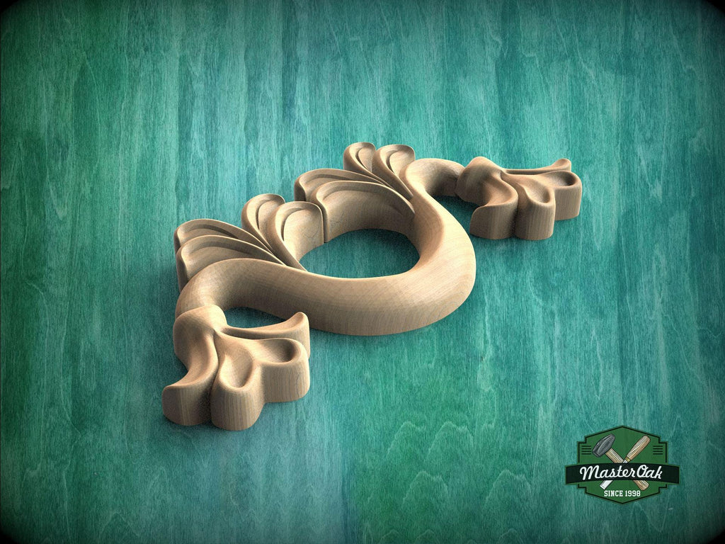 A wooden carving of a stylized flower or plant with intricate details is displayed against a green background.
