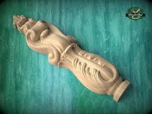 Load image into Gallery viewer, A wooden carving of a decorative finial or finial-like object is shown against a green background.
