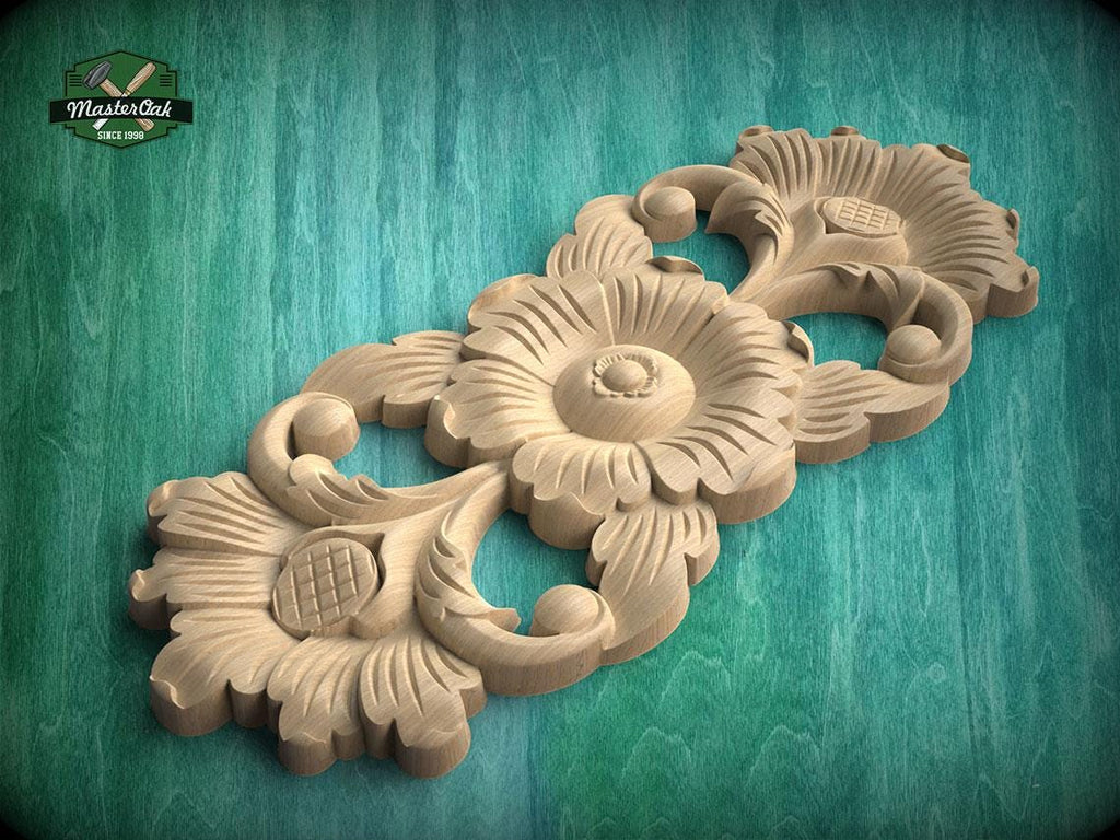 A wooden carving of a flower-like design with intricate details, displayed against a green background.