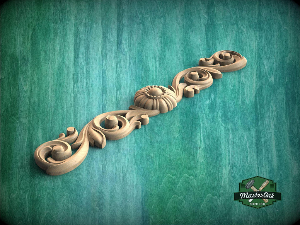 a wood carving of a spiral design on a green background