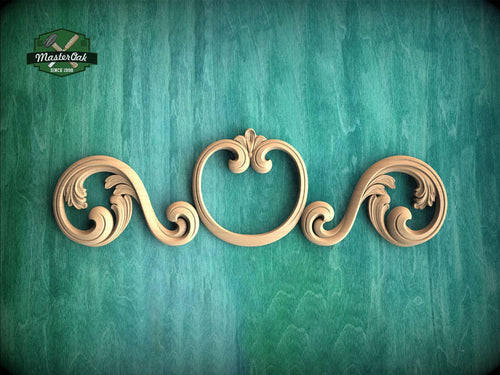A decorative wooden scrollwork piece with intricate scrollwork designs is displayed against a green textured background.