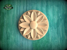Load image into Gallery viewer, A wooden flower-shaped object is centered against a green background.
