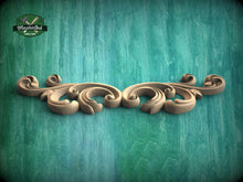 Load image into Gallery viewer, a green background with a decorative design on it
