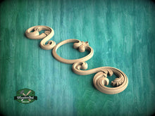 Load image into Gallery viewer, A decorative wooden carving in the shape of a flower is displayed against a teal background.
