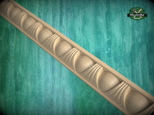 Load image into Gallery viewer, A decorative wooden molding with a repeating pattern of curved shapes is displayed against a green textured background.
