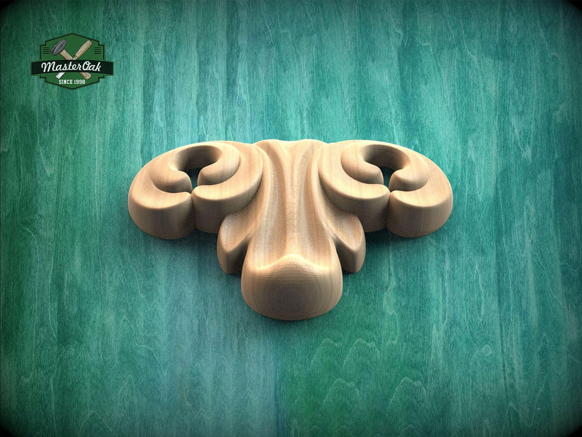 A wooden carving with a curved, organic shape is displayed against a green background.