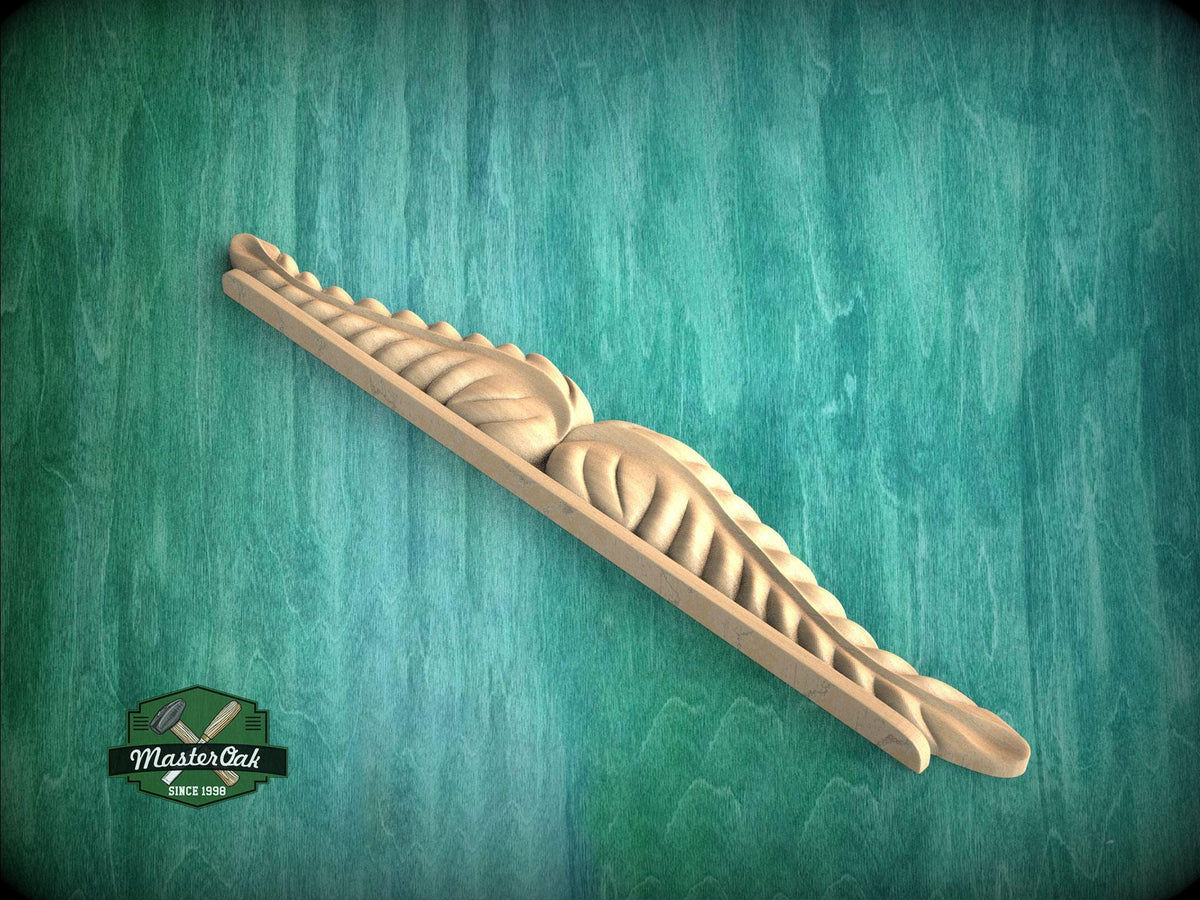 A wooden carving with a leaf-like design is displayed against a green textured background.