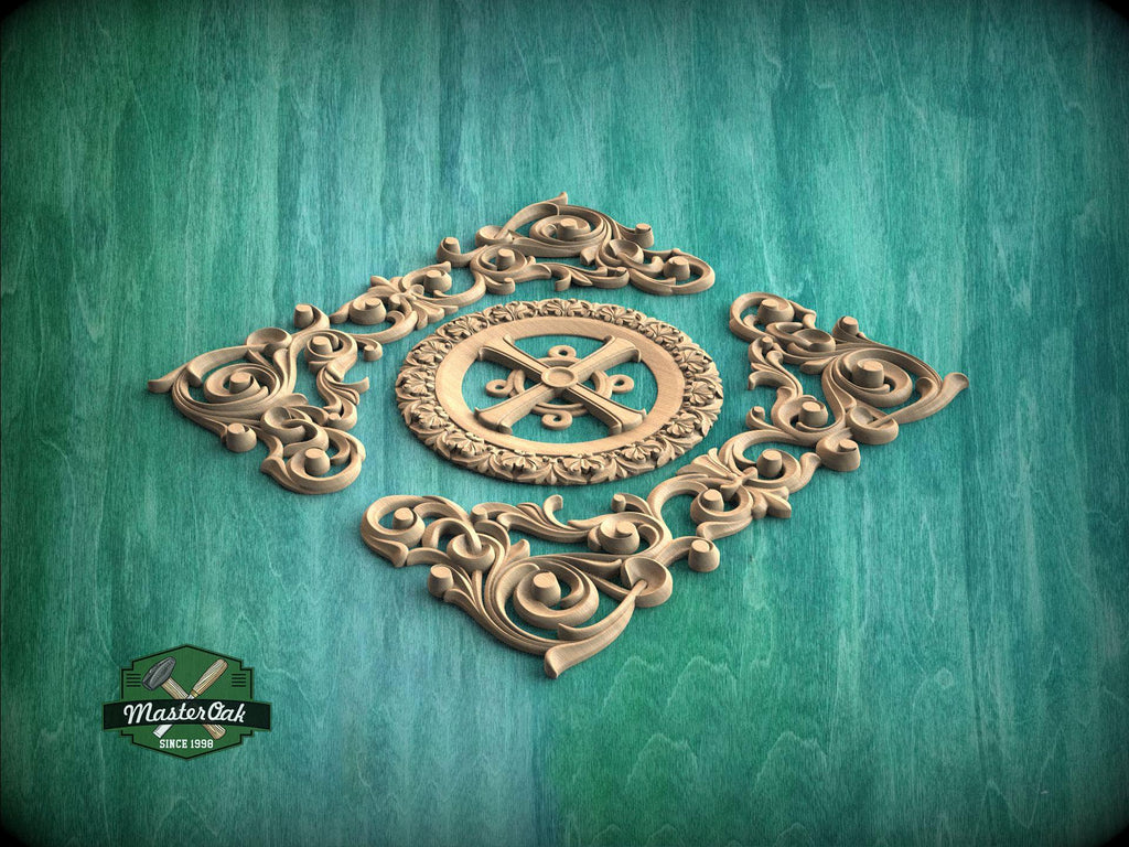 a decorative wooden carving with intricate scrollwork and a central motif, set against a green wooden background.
