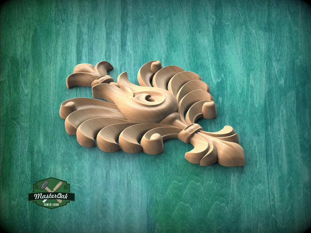 A wooden carving of a stylized flower or leaf design is displayed against a green background.