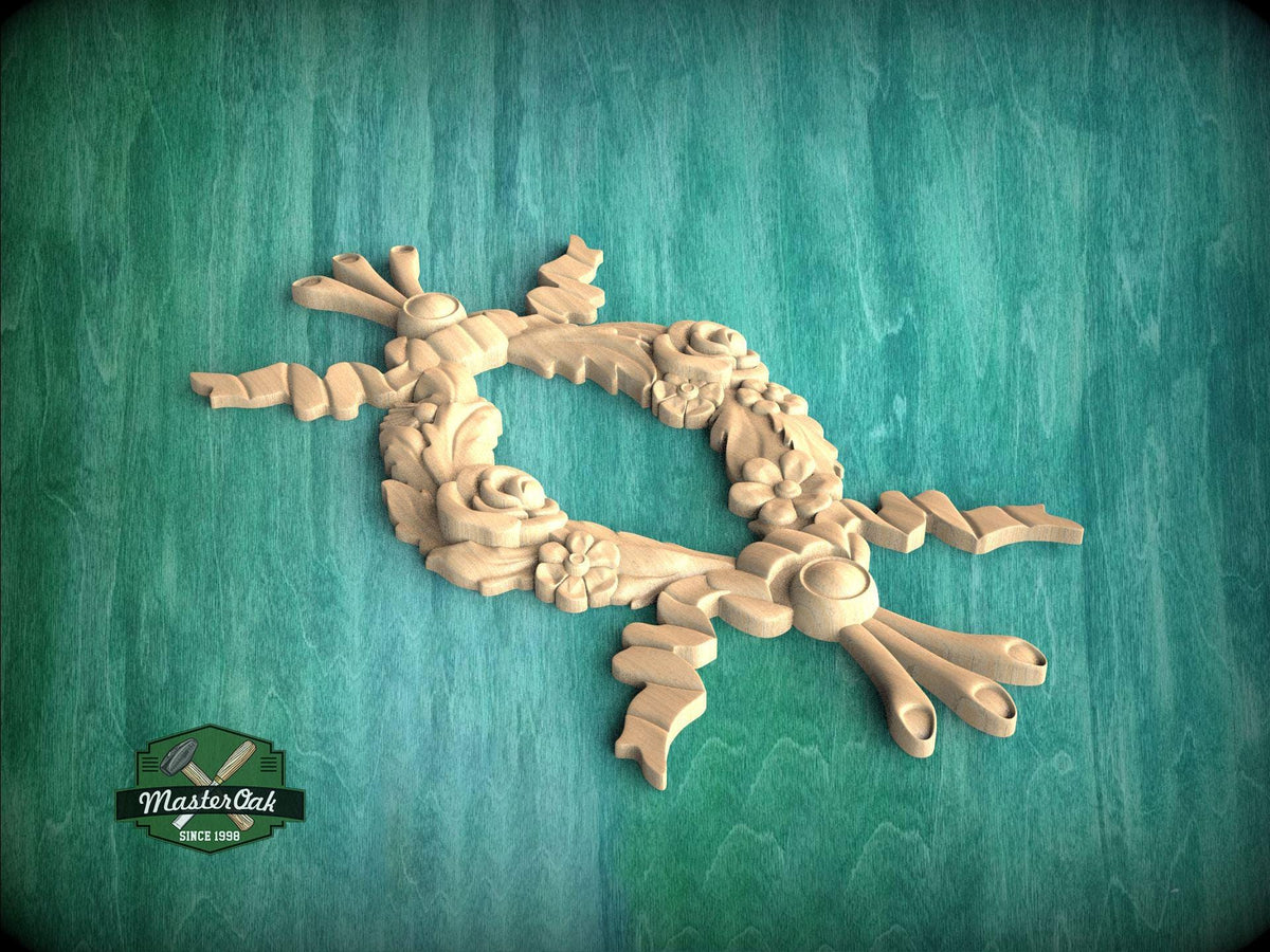 A decorative wooden wreath with intricate floral designs is displayed against a green wooden background.