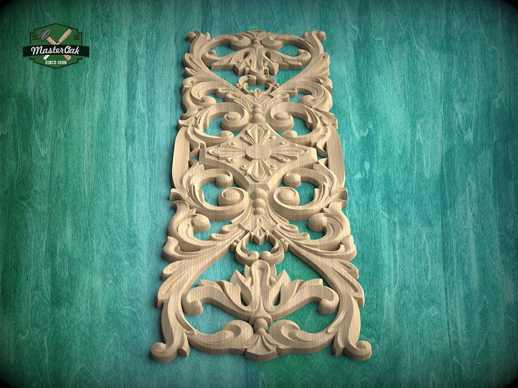 an ornate, carved wooden panel with intricate floral and scroll designs, set against a green background.