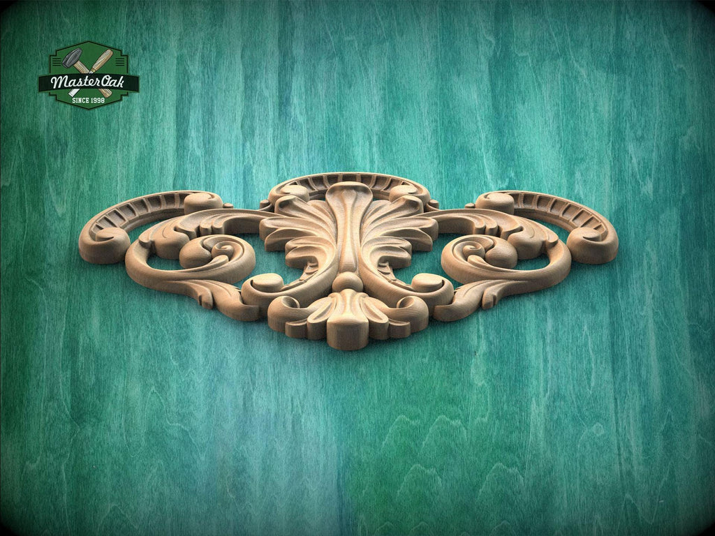 a wood carving of an ornate design on a green background