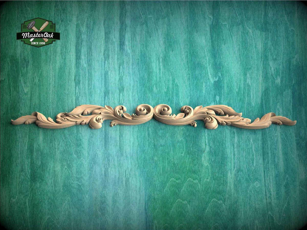 A decorative wooden carving with intricate scrollwork is displayed against a textured green background.