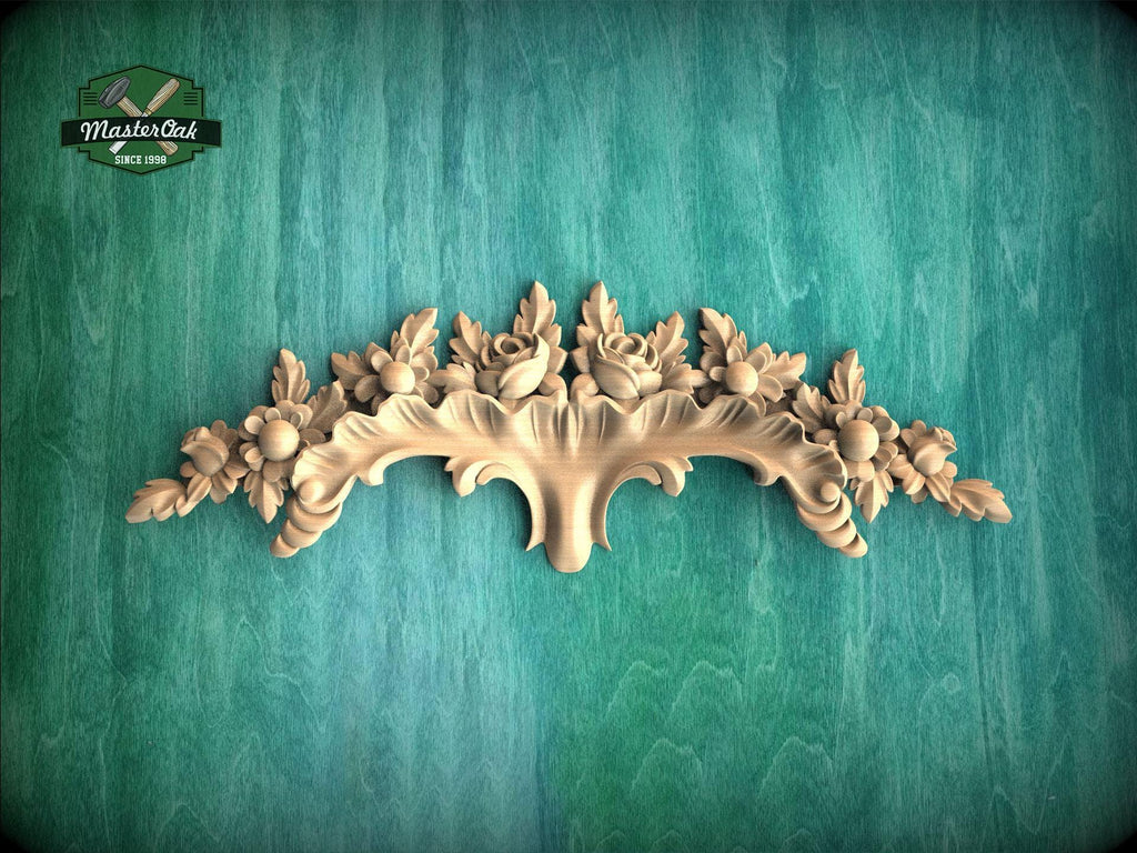 a decorative wooden carving on a green background.