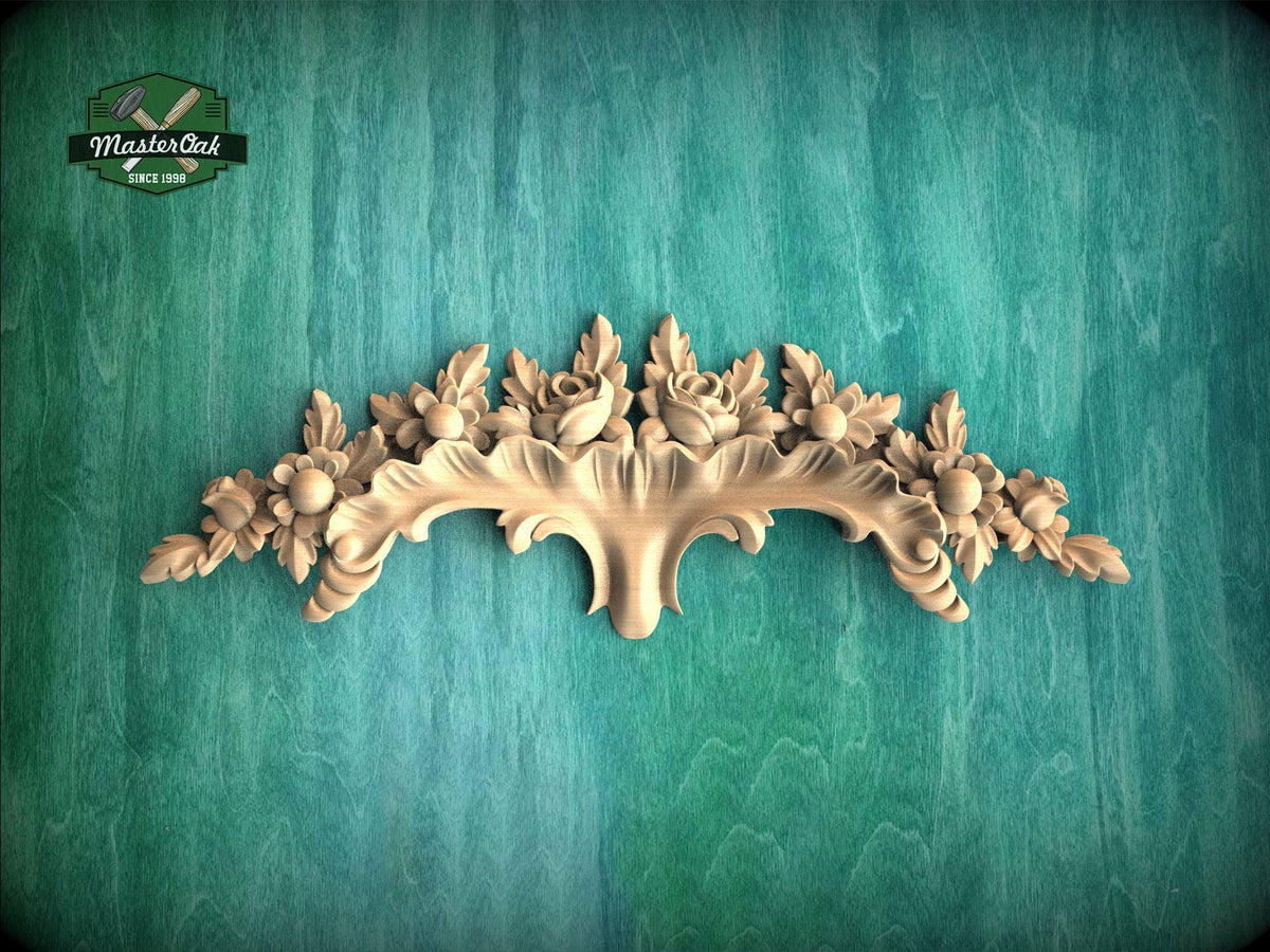 a decorative wooden carving on a green background.
