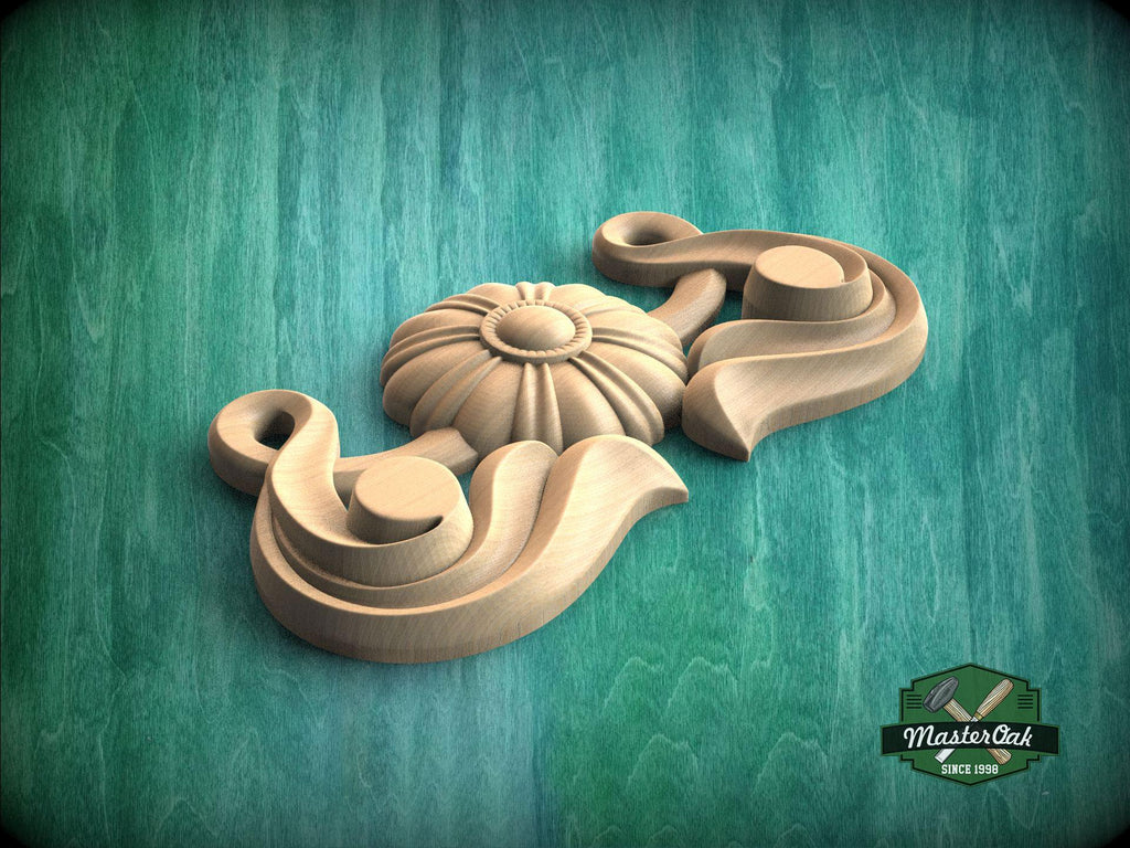A wooden carving of a flower-like design is displayed against a green background.