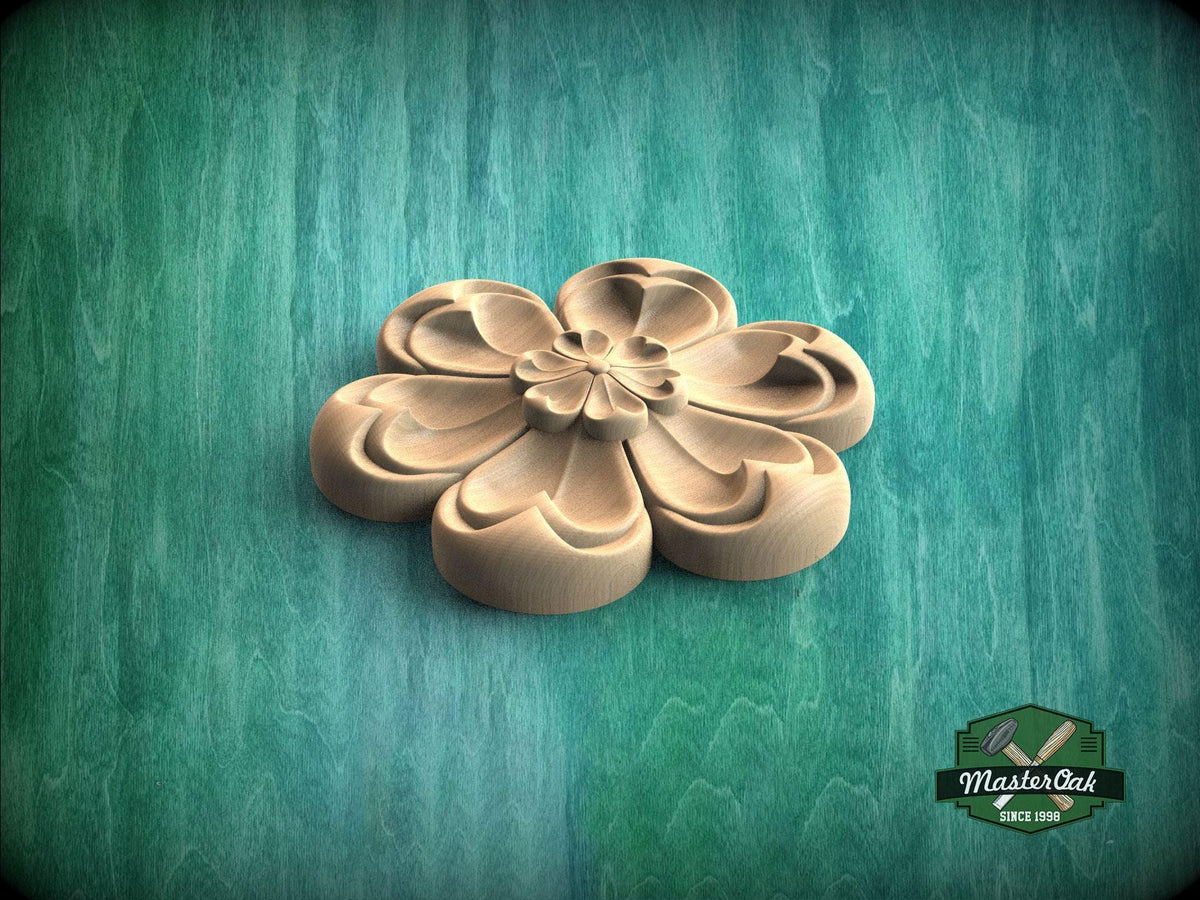 A wooden flower-shaped object is displayed against a green background.