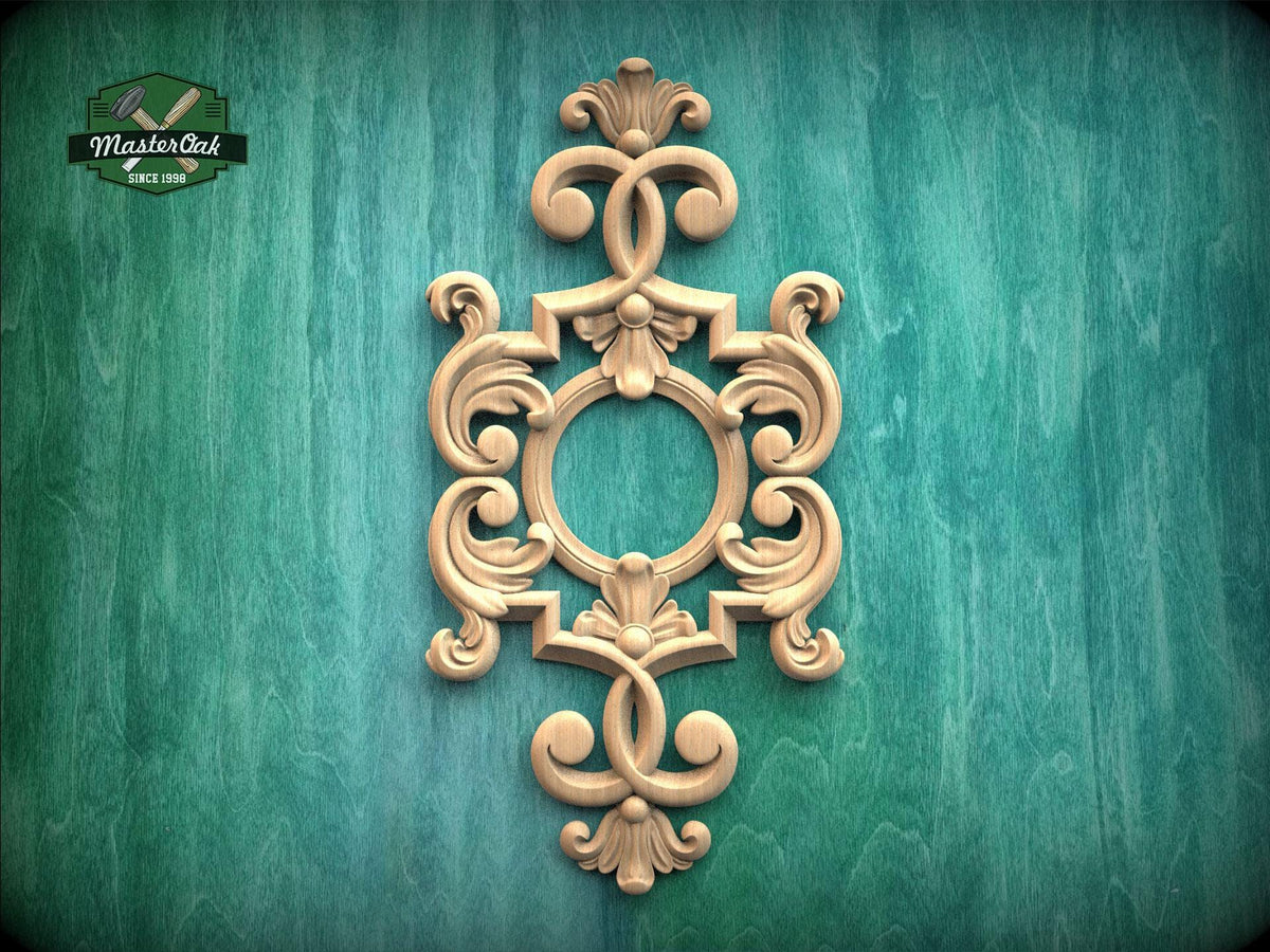 an ornate, carved wooden frame with intricate scrollwork and floral designs, set against a green textured background.