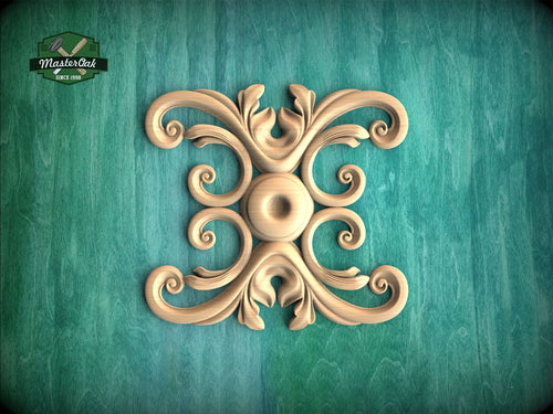 a decorative wooden carving with an intricate design on a green background.