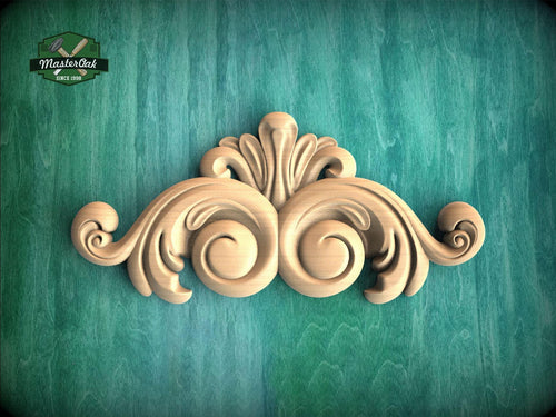 A decorative wooden carving in the shape of a scroll or scrollwork is displayed against a green textured background.