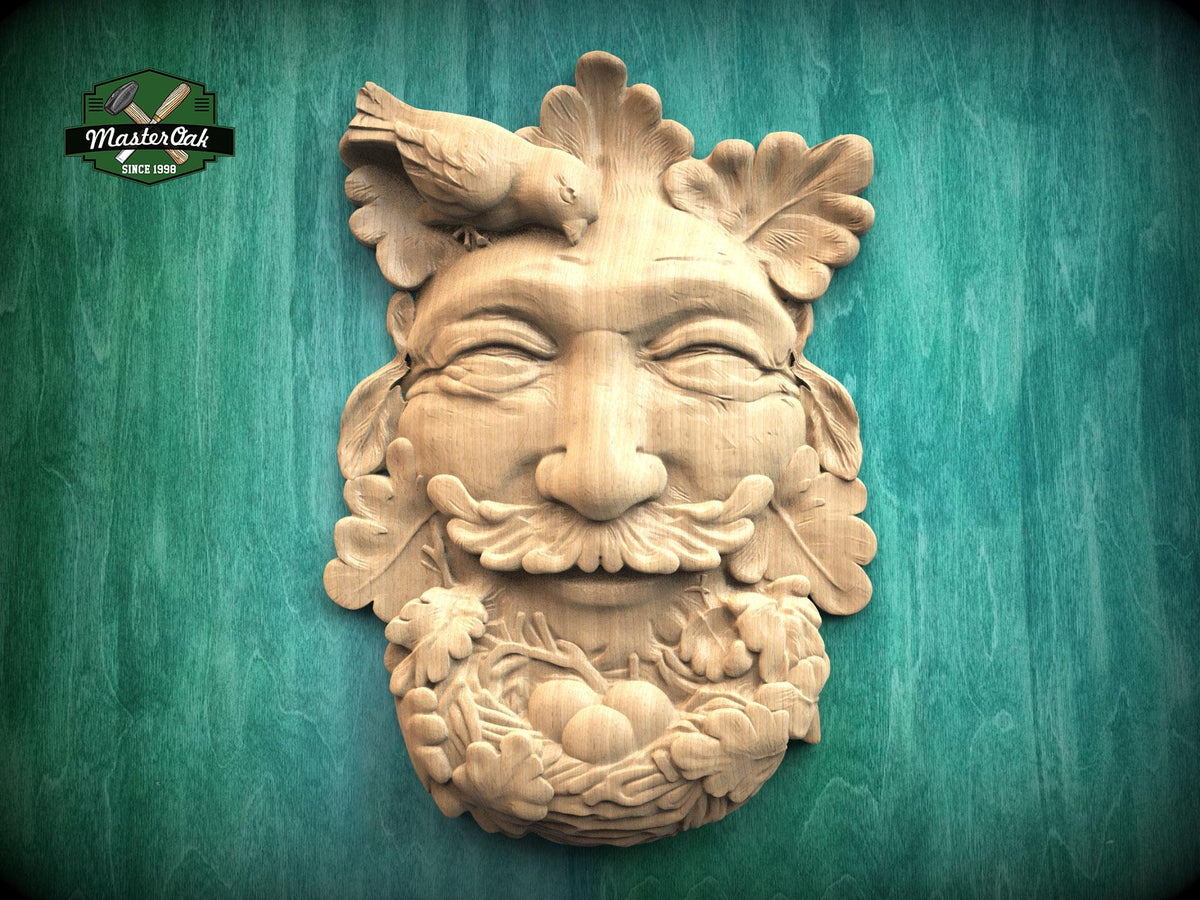 Carved wooden Green Man onlay featuring a forest face surrounded by oak leaves, with a bird resting above and a nest below, shown in natural wood finish on a textured background.