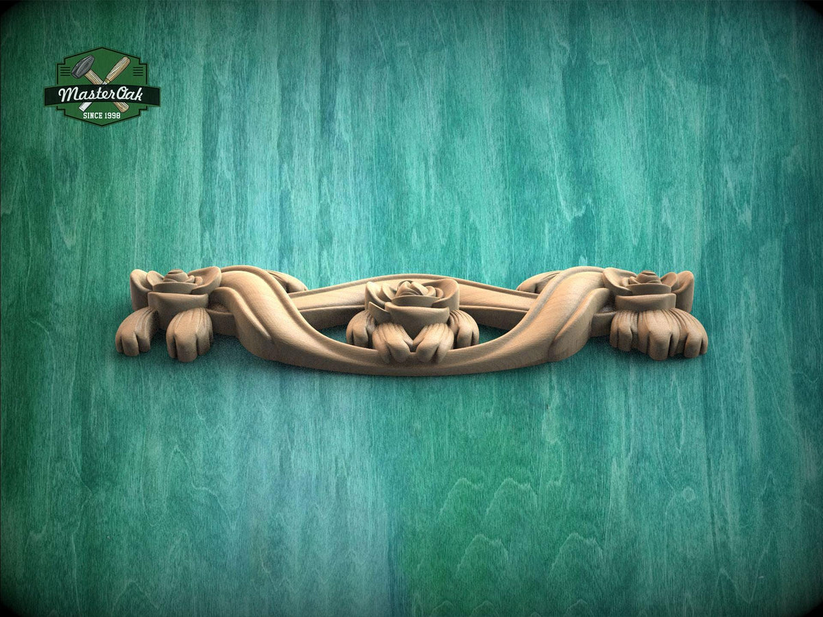 A wooden carving of a floral design is displayed against a green textured background.