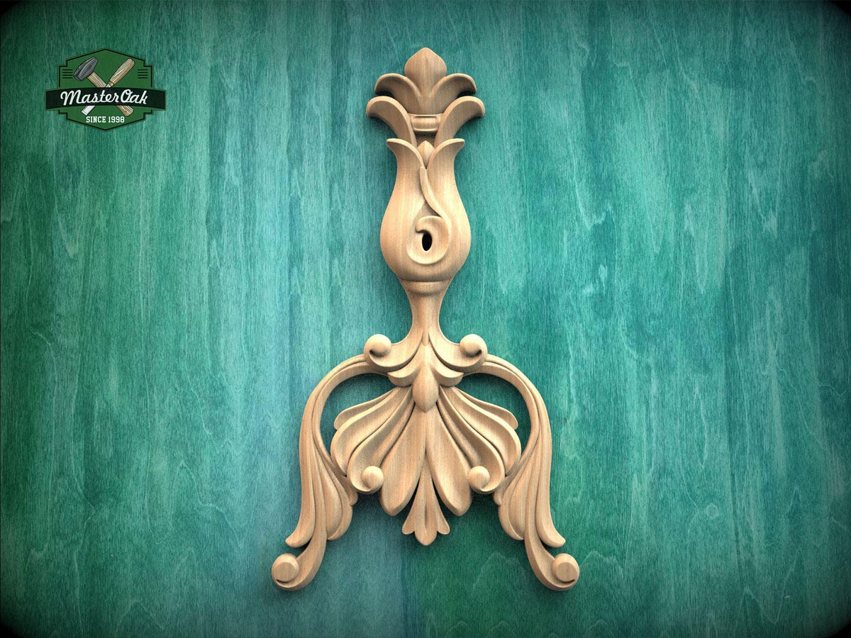 a decorative wooden carving on a green background.